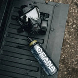 cana provisions grey nalgene bottle on a truck trailgate with a gas mask attached