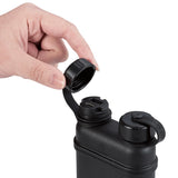hand opening the cap of a black outdoor battery on a white background