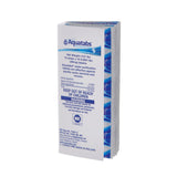 A pack of Aquatabs water purification tablets, shown on a plain white background. The packaging is white with blue text and water wave graphics, and a blue warning label on the front.