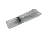 60ml backflush water syringe with measurement markings on a white background, inside of its clear plastic manufacturer sterile packaging