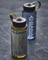 Two bottles with 'Cana Provisions' branding on a textured surface