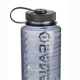 A translucent grey Nalgene water bottle with a black screw cap and carrying loop, shown against a plain white background.