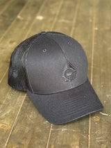 Black baseball cap with a logo on a wooden surface