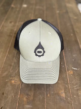 light green Baseball cap with black logo on a wooden surface