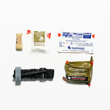 Collection of medical supplies including bandages and a trauma device on a white background
