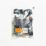 Collection of medical gear items inside of clear packaging on a white table