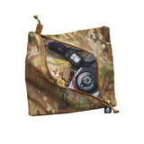 A camouflage mesh zippered pouch shown open, revealing a flashlight and other gear inside, on a plain white background.