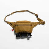 Tan waist bag with a strap on a white background