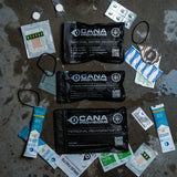 Collection of CANA Provisions personal water decontamination and rehydration kits on a textured surface.