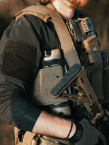 Person wearing tactical gear on a blurred background