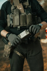 Person in tactical gear holding a iceflask tactical water bottle