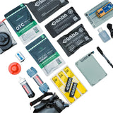 Collection of gear and first aid kits and supplies on a white background
