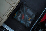 collection of assorted cana provisions water treatment and purification tools inside of a black mesh pouch on a black background