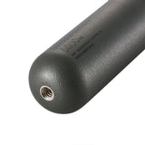 Close-up of a black textured handle with a thread on a white background