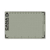 a green label or card with grid lines and cana provisions logo with no background