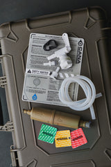 water filter components on a green case with labels and hoses