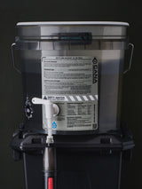 water filter components on a grey background with labels and hoses