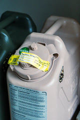 cana provisions water treatment record safety labels affixed to a tan water jerry can and jerry can water data decal applied 