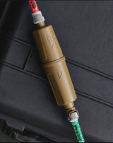 tan msr water filter on a black background
