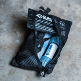 water filter gear in a black mesh pouch on a concrete surface.